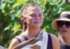 Make an unconventional hiking gear with Chrissy Teigen's Bathing Suit & Sleek Sneakers.