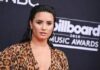 Demi Lovato's 'Sorry, Not Sorry' apology has been called out by a frozen yoghurt shop, which denies the star donated