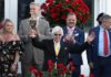 Bob Baffert holds up the winner’s trophy