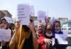 Hundreds of people demonstrate in front of the United Nations offices in New York, protesting infringement of women's rights in Afghanistan.