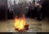 As an Afghan musician cries, the Taliban set fire to an instrument in front of him
