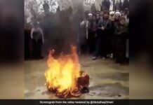 As an Afghan musician cries, the Taliban set fire to an instrument in front of him As an Afghan musician cries, the Taliban set fire to an instrument in front of him