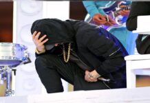 During his Super Bowl halftime performance, Eminem took a knee