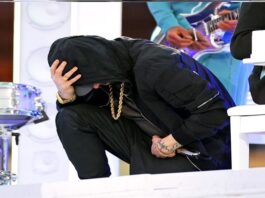During his Super Bowl halftime performance, Eminem took a knee