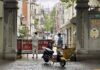 Outside Covid-Hit Buildings in Shanghai, Mesh Barriers Are Erected