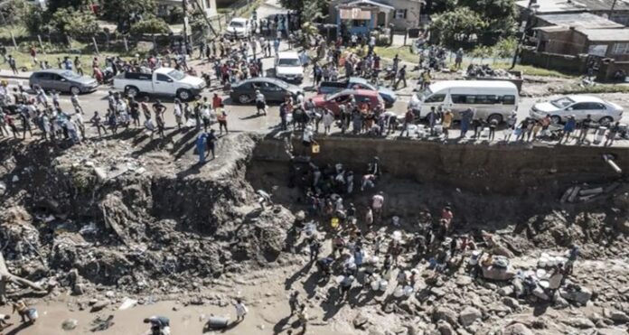 FLOOD flood-ravaged, South African city, No power or water