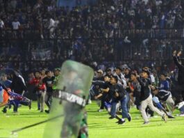 After a stampede to exit an Indonesian soccer match, 129 people killed
